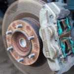 Maintenance repair and cleaning disc brake and asbestos brake pads it's a part of car use for stop the car for safety at front wheel this a new spare part for repair at car garage
